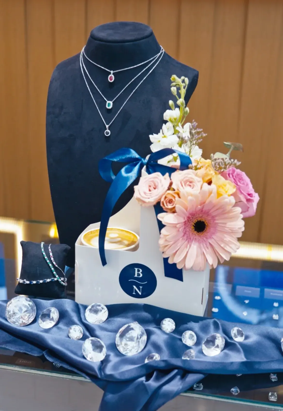 Blue Nile branded gift box with jewelry display and flowers at the Fez Coffee activation.